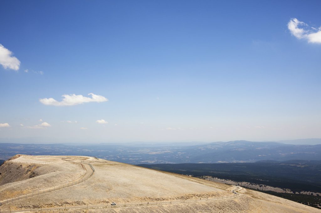 Scenic View Of Landscape Against Blue Sky